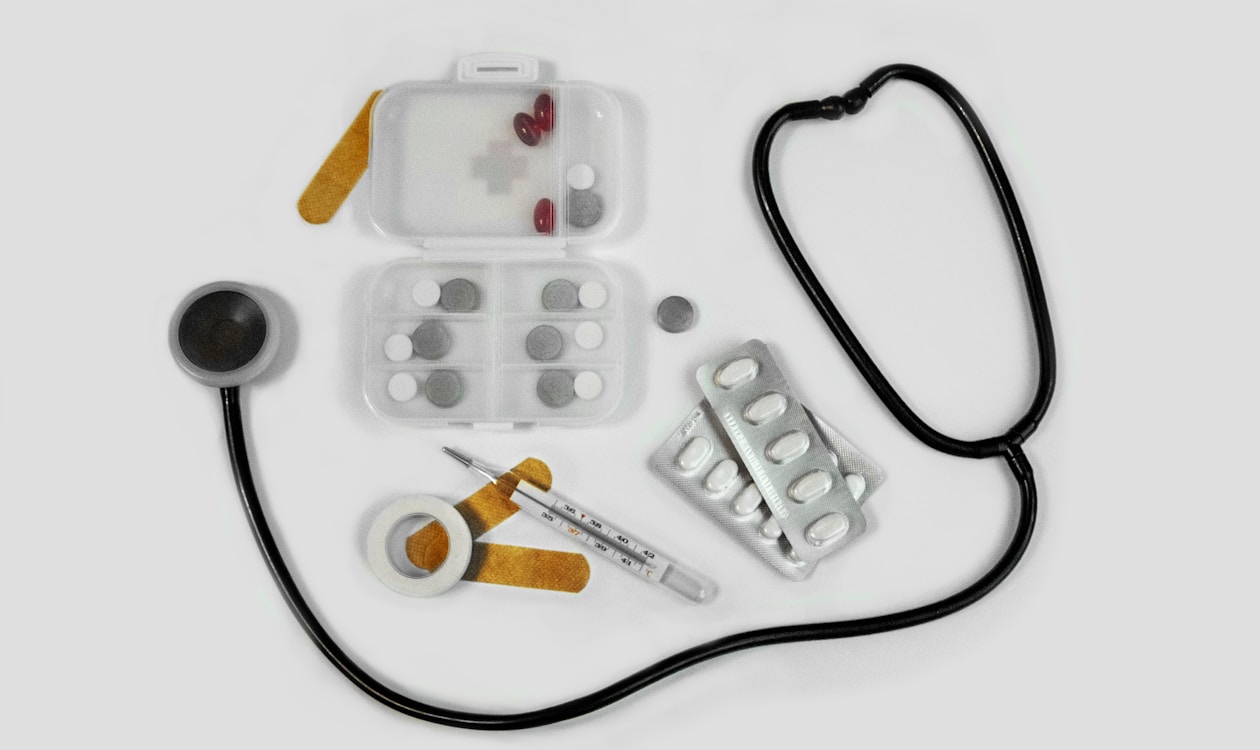 First aid medical supplies including stethoscope, thermometer, bandages and medication
